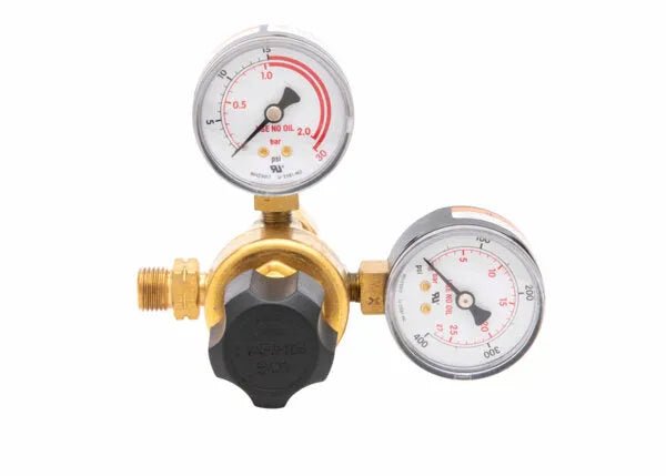 Harris 601-15-520-B single stage acetylene regulator for welding, brass body, dual gauges, black knob, on white background.