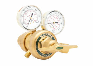 A brass Harris 9200-50 two stage oxygen regulator with two pressure gauges and a control lever, ideal for welding applications, isolated on a white background.