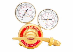 Gold Harris two stage regulator with two pressure gauges, labeled in psi and kPa, and a red label reading Harris 9200 - 50 psig. The regulator features a control handle and brass fitting—ideal for welding applications.