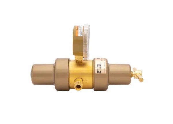 A brass and gold-toned industrial pressure regulator water filter with a built-in pressure gauge on top and a shut-off valve on the side, isolated on a white background.