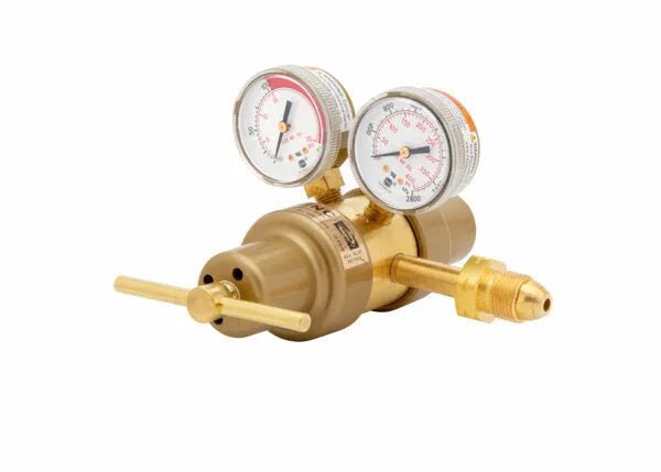 A Harris 9296 two stage regulator for acetylene, featuring a brass body, two round pressure gauges, T-shaped adjustment handle, and a threaded connector, shown on a white background.