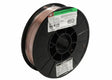 A Harris ER70S-6 Mild Steel MIG Welding Wire .045 11# SPOOL (E70S6H5) features copper-coated wire on a black plastic reel, with white and green labels displaying product details and barcodes; some wire is unwound near the center.