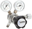The Harris 721C-250-346-D Medical Air Regulator features a chrome body, stainless steel diaphragm, dual pressure gauges (psi/kPa) with clear needle indicators on white faces, a black “HARRIS SPECIALTY GAS” knob, and metal gas connectors.