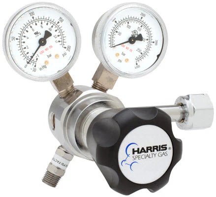 The Harris Regulator 721C-500-350-D features two analog pressure gauges, a black HARRIS SPECIALTY GAS knob, and metal fittings for cylinder attachment, making it ideal for high purity gas applications.