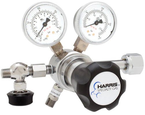 The Harris Two Stage Ultra High Purity Brass Barstock Regulator Model 721C-250-326-A features two pressure gauges, multiple ports, a black “Harris Specialty Gas” knob, and a stainless steel diaphragm for specialty gas regulation.