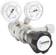 The Harris 742-250-350-C Regulator, with a metallic body, two round pressure dials, and a black HARRIS SPECIALTY GAS knob, controls and monitors gas flow for chlorine, carbon monoxide, propane, and hydrogen in specialty gas systems.