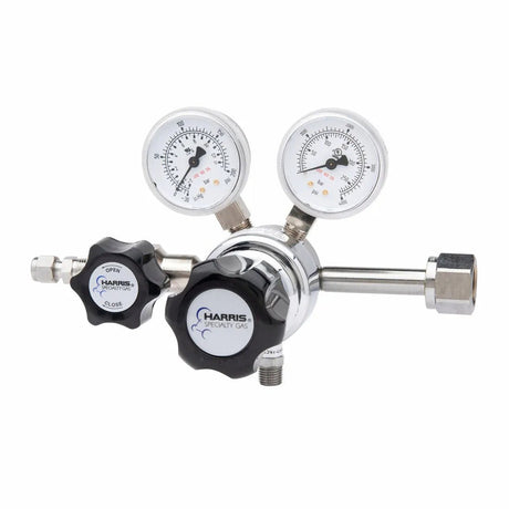 The Harris 701-125-320-BE Carbon Dioxide Regulator features single-stage regulation, two pressure gauges (psi/kPa), black control knobs, a metal cylinder fitting, and a stainless steel diaphragm for precise gas control.