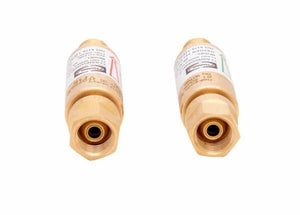 Two brass regulator-type flashguard flashback arrestors with labeled stickers, viewed from the nozzle ends, are placed side by side on a white background for oxygen and fuel gas applications.