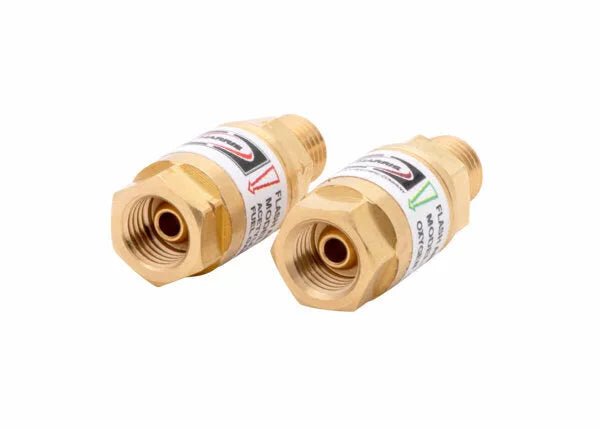 The Harris 4302205 88-5 FBTA Torch-Type Flashback Arrestor (R&L) features two hex-ended, threaded brass units with white labels and directional arrows for safer gas welding with HVAC torches.
