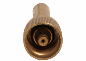 Close-up view of a brass garden hose connector fitting, often used in metal fabrication or welding and heating setups, showing the threaded interior and central rubber gasket for sealing.