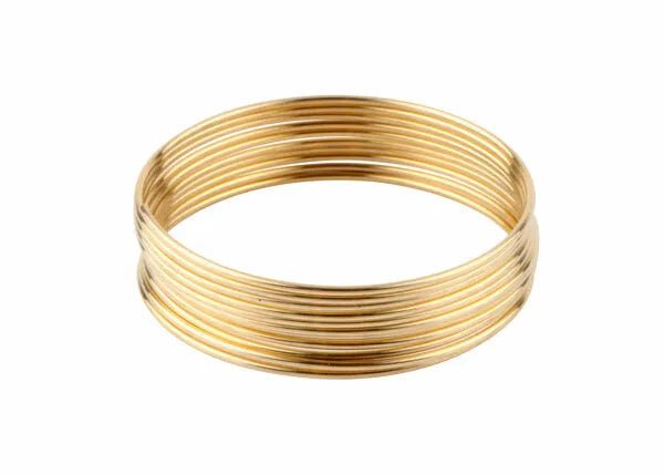 A stack of thin, shiny gold bangles arranged in a circle on white background, their smooth finish echoing the polished elegance of Harris 3531 - Safety-Silv® 35 high silver brazing alloy 1/16 in. x 1 ea. 1 toz. cup.