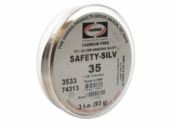 A round metal tin of Harris 3533 - Safety-Silv® 35 high silver brazing alloy, cadmium-free with 35% silver, size 1/16, net weight 3 oz. Label warns: READ WARNING ON REVERSE SIDE.