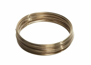 A coiled loop of Harris 4535 Safety-Silv 45 Silver Brazing Alloy, 1/16 in (1.6 mm) diameter, 5 toz cup, lies on a white background. Its smooth, shiny metallic surface reflects light and appears bright and polished.