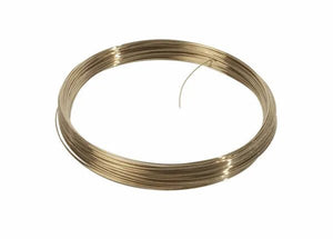 A neatly coiled loop of Harris 50N325 Safety-Silv 50N Silver Brazing Alloy, 1/16 in (1.6 mm), sits on a plain white background with one loose end protruding, showing the shiny silver wire remains unused.