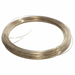 A neatly coiled loop of Harris 56350 - Safety-Silv 56 Silver Brazing Alloy, 1/16 in (1.6 mm), 50 toz, is arranged on a white background; this cadmium-free wire appears metallic and reflective, with several loose ends extending outward.