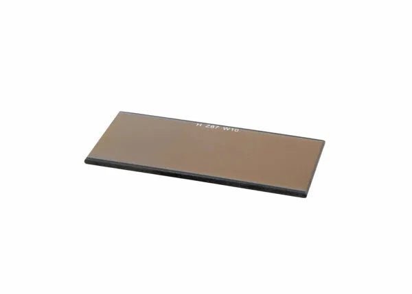 Harris 2"x4-1/4" Shade 10 Gold Mirror Welding Filter Lens, brown glass, for welding helmets, shown angled on white background.