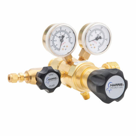 The Harris Two Stage Ultra High Purity Brass Barstock Regulator Model 722-500-350-BE features two pressure gauges, labeled dials, and black knobs marked “open” and “close,” each displaying the Harris Specialty Gas logo.
