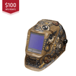Steampunk-style welding helmet with digital display on a white background, featuring a $100 MFG rebate label.