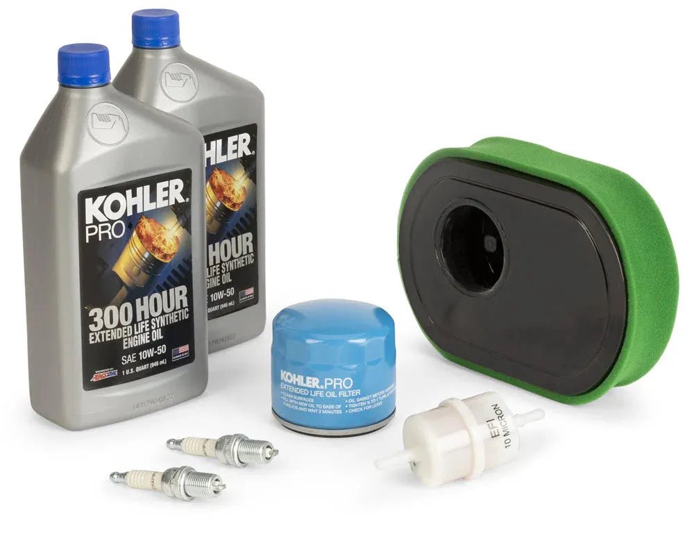 The Lincoln Kohler ETB ECH749 Engine Service Kit K5546-1 includes two bottles of Kohler Pro oil, an air filter with green foam cover, an oil filter, fuel filter, and two spark plugs—all neatly arranged on a white background.