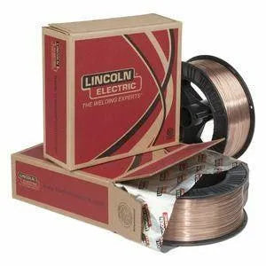 A red and beige Lincoln Electric box labeled “The Welding Experts” is placed beside and under two spools of copper-colored Lincoln .045 PIPELINER 70S-G 30# SPOOL ED030905 wire, one partially wrapped in branded silver foil.