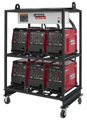 The Lincoln 6-PACK RACK FLEXTEC 450 K2957-2 is a black metal cart on wheels with heavy-duty inverter racks, holding six red-and-black Flextec 450 welding machines in two shelves of three and featuring a white power unit on top.