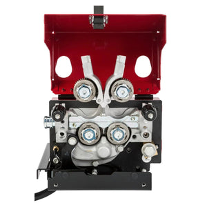 A close-up of the Lincoln AutoDrive 4R100 Wire Drive K3560-1 shows four metal gears in a black base with an open red cover, exposing internal components and rollers for robotic wire feeding in automated welding.