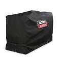 The Lincoln Ballistic Nylon Storage Cover K5292-1 is a large, rectangular black fabric cover with white and red Lincoln branding. It fits welding machines, features bottom straps and reinforced corners, and protects engine driven welders.