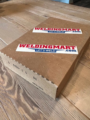 WeldingMart.com box with Lets Weld stickers, Lincoln OEM CONTROL PC BOARD L5224-5, codes, and date on wooden table.