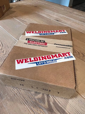 WeldingMart shipping box with Lincoln OEM CONTROL PC BOARD L5224-5 stickers on wooden table, welding equipment packaging.