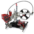 The Lincoln Cruiser Submerged Arc Welding Tractor K3048-2 features a red control box, large wire spool arm, feed mechanism, sturdy wheeled frame, and visible branding with attached cables and components.
