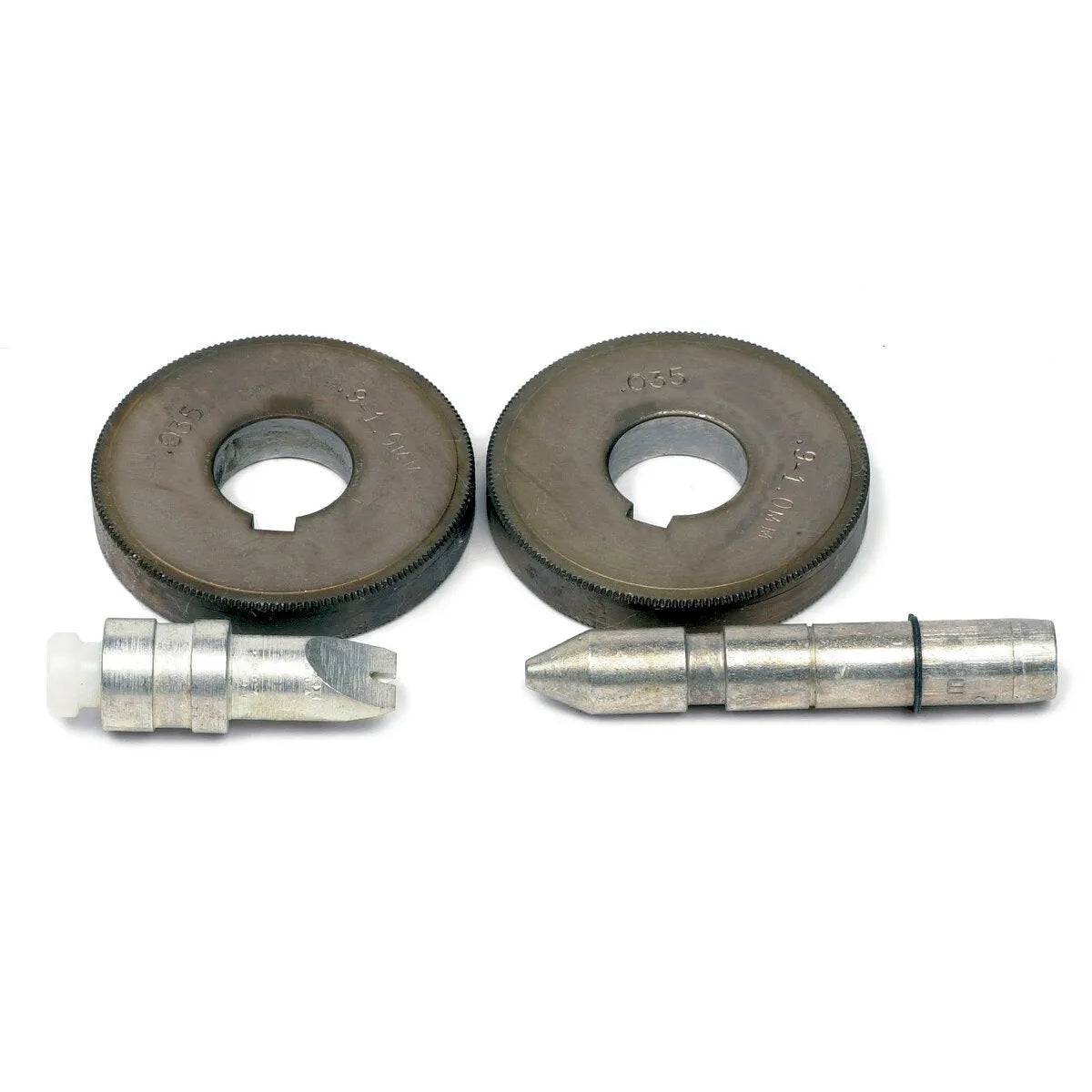 Two metal ring gauges with central holes are above two Lincoln Drive Roll Kit 7/64-.120 in (2.8-3.0 mm) Cored Wire KP653-120C components—one resembling a guide tube kit with slotted tip and plastic end, the other with a pointed tip and groove, all on a white surface.