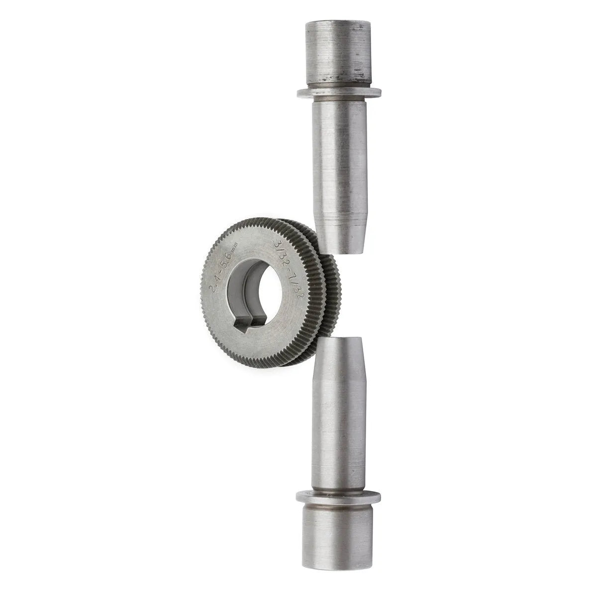 A metal gear with fine teeth and a central hole sits vertically between two cylindrical shafts, as included in the Lincoln Drive Roll/Guide Tube Kit .035in-.052in Solid Wire KP1899-3, all aligned on a white background.