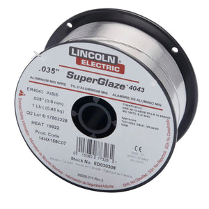 A spool of Lincoln Electric SuperGlaze 4043 MIG aluminum welding wire, ER4043 alloy, 0.035-inch diameter, weighing 1 lb. The label displays technical details and safety information. Also available: SuperGlaze 5356 aluminum-magnesium alloy.