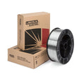 A spool of MIG welding wire stands upright in front of two stacked Lincoln Electric branded cardboard boxes on a white background, ideal for use with duplex stainless steels in demanding projects like nuclear plant construction.