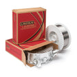 A 33 lb spool of Lincoln ED034293 Primalloy T-439Ti 0.045 in metal-cored GMAW-C welding wire rests beside its open red and brown Lincoln Electric box, with a second closed box and visible welding labels on a white surface.