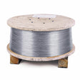 A large 500 lb Speed Feed Reel of Lincoln ED035161 Lincolnweld 308/308L SAW Welding Wire (3/32 in) sits on wooden blocks with a white label attached, highlighted against a plain white background.