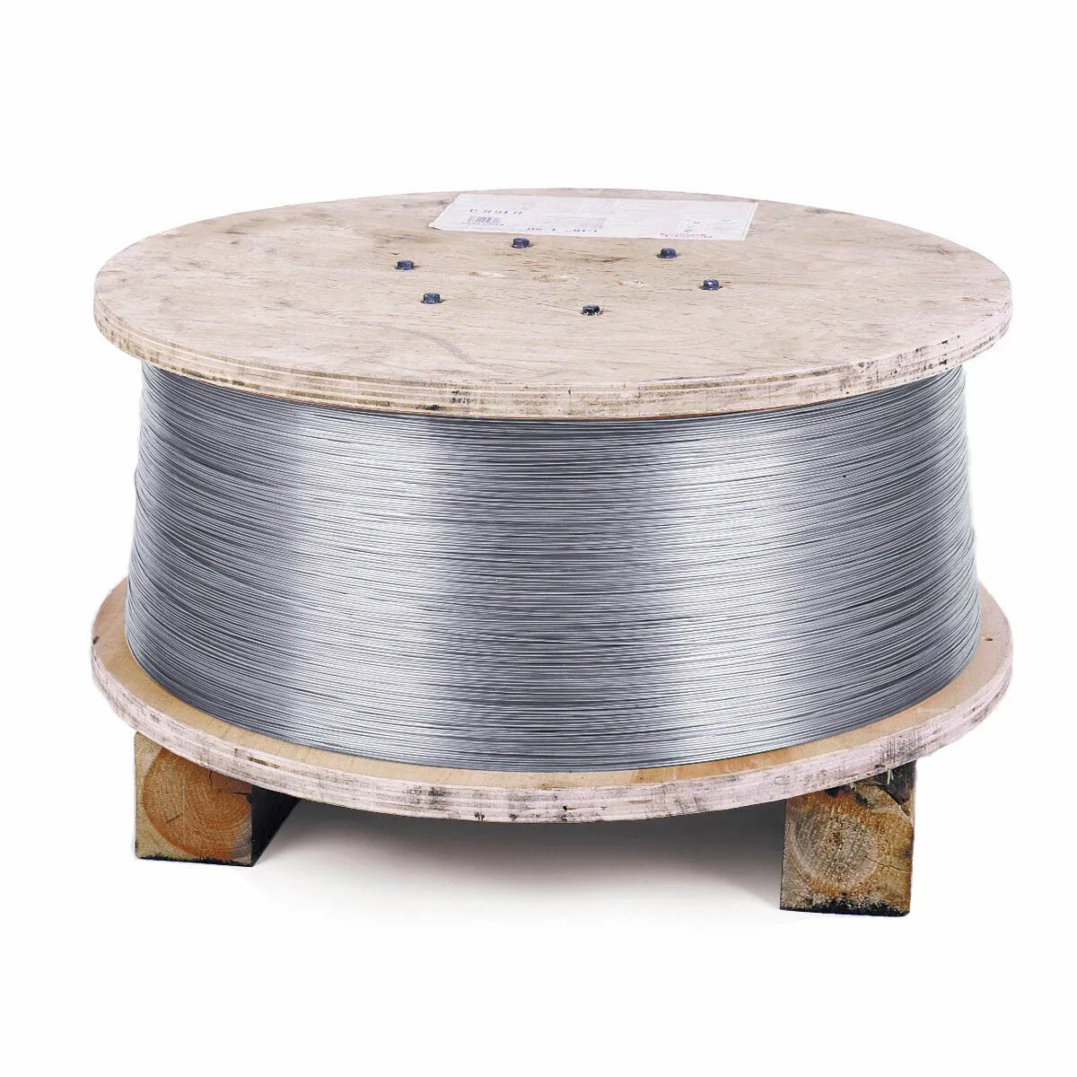 A 500 lb Speed Feed Reel of Lincoln ED035184 Lincolnweld 347 Submerged Arc (SAW) Wire, 3/32 in, sits on blocks with a label on top. The plain background highlights the industrial reel and its shiny stainless steel wire coil.