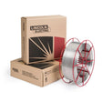 Lincoln ED037983 Red Max 308LSi MIG stainless welding wire 0.035" 33lb spool with red supports, shown by Lincoln Red Max boxes.