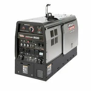 The Lincoln VANTAGE 500 (PERKINS) COMPACT CASE K2686-1 is a black and silver diesel welder generator for multi-process welding, featuring front control knobs, switches, meters, ventilation grilles, and a top carrying handle.