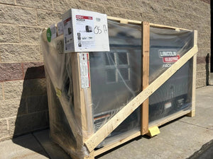 Lincoln Frontier 400X demo engine-driven welder Kubota U3484-2 in crate, wrapped for shipping, at WeldingMart, brick wall backdrop.