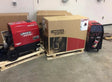Lincoln Precision TIG 225 Welders Ready-Pak with Cart, boxed and unpacked, plus a compact TIG welder on concrete floor. WeldingMart.