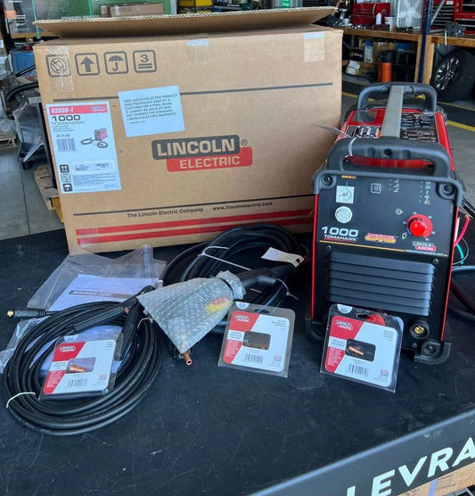 Lincoln Tomahawk 1000 Plasma Cutter with hand torch, cables, box, manuals; top welding equipment for industrial metal cutting.