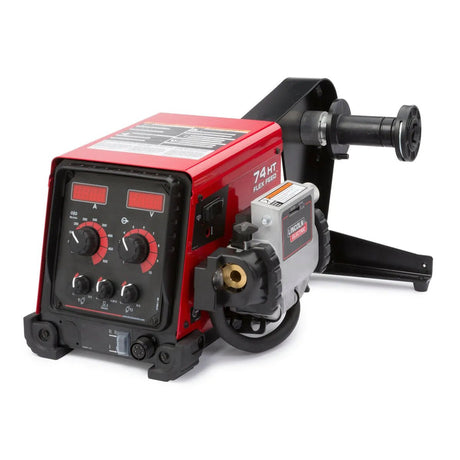 A red and black Lincoln Flex Feed 74 HT Digital U/I, Std. Dty. Reel K3883-6 wire feeder with dual digital displays, control knobs, and side spool holder sits compactly on a sturdy black base.