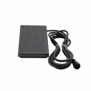 The Lincoln Foot Pedal K4361-1 is shown: a black rectangular pedal with a textured surface and a long cable ending in a round multi-pin connector, coiled beside it for precise amperage control. The background is plain white.