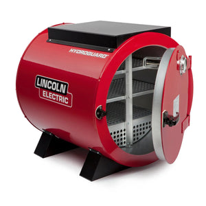 The Lincoln HydroGuard Bench Welding Rod Oven 240/480 V K2942-2 is a red, cylindrical oven on black legs, featuring open shelves for stick electrode storage and the brand logo displayed on the side for moisture-resistant protection.