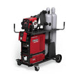 The Lincoln HyperFill Reveal Power Feed 84 Dual Ready-Pak, Dual Cart (K4650-6) features a red and black MIG setup on a wheeled cart with two upright gas cylinders, cables, controls, and handles for easy maneuvering.