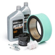 The Lincoln Kohler Tune Up Kit (CH23S/CH730/ECH740) K3494-1 includes two Kohler 10W-30 oil bottles, a blue foam air filter, black oil filter, white fuel filter, and two spark plugs—perfect for Lincoln welder upkeep with all items shown on white.
