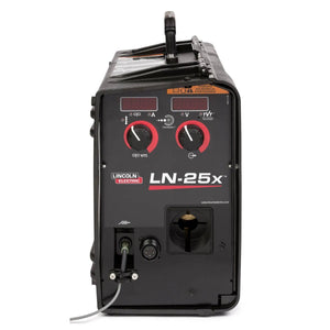 The Lincoln LN-25X w/CrossLinc and TVT (No Flowmeter, Tweco) K4267-2 is shown front-facing, featuring two red knobs, a digital display, input ports with labels, a top handle, and a cable connected to the lower left port.