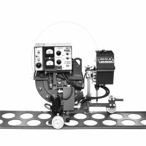 Black-and-white image of a Lincoln LT-7 Tractor (Track Model) K395-1 welding machine with a submerged arc wire feeder, dials, gauges, ARC Welder box, and mechanical parts moving along its perforated metal track.