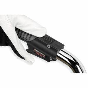 Gloved hand holding Lincoln Magnum PRO LFG 350 Fume Gun K4464-2 welding tool with chrome lever, grip, and fume extraction.